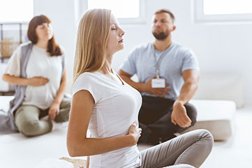 People meditating.