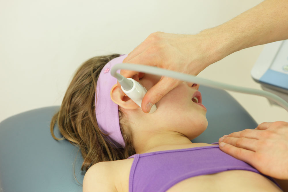 Patient having facial treatment