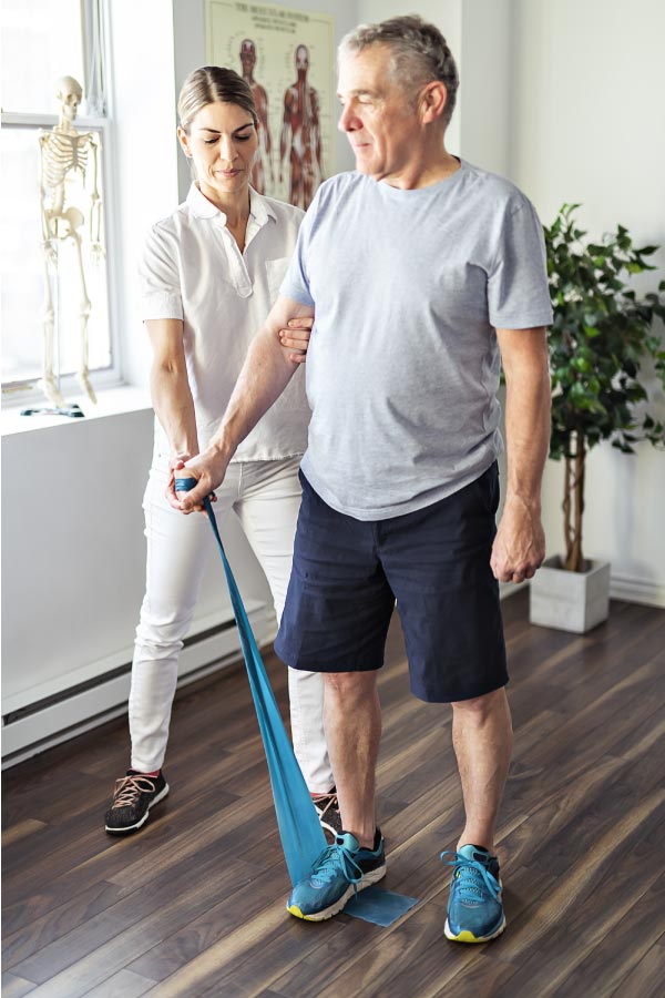 Patient assisted by his therapist